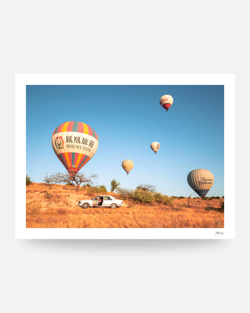 Parked. — unframed limited edition fine art print on cotton rag with pencil signature; hot air balloons over a parked car in the Cappadocia desert